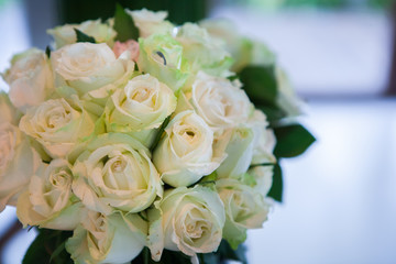 Wedding bouquet of white roses in the bride room