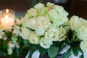 Candle and Wedding bouquet of white roses