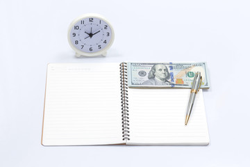 Fototapeta na wymiar Blank notebook with clock and dollar bill for money and time con