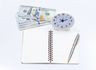 Blank notebook with clock and dollar bill for money and time con