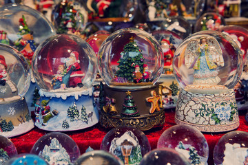 Beautiful Christmas snow globes at the Christmas market in the city, Germany - obrazy, fototapety, plakaty