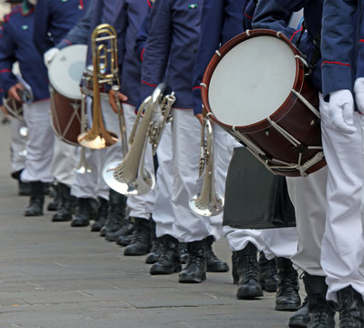 Parade of musicians of the band in uniform on the town square