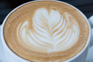 hot coffee latte, latte art with heart in a white cup