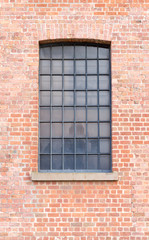 Fototapeta na wymiar Window on brick wall.