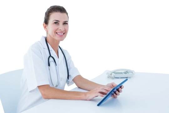  image of young doctor standing with tablet pc