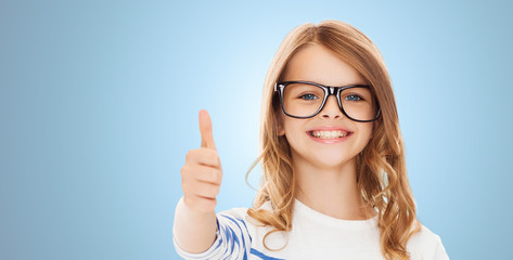 little girl with black eyeglasses