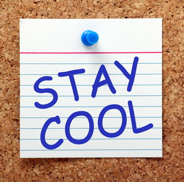 The phrase Stay Cool on a reminder note pinned
to a notice board