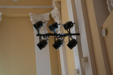Equipment for stage lighting, hanging on the wall in the concert
