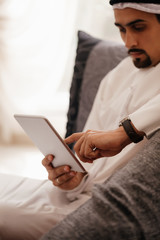 Arabian Male Using Smart Phone Indoors
