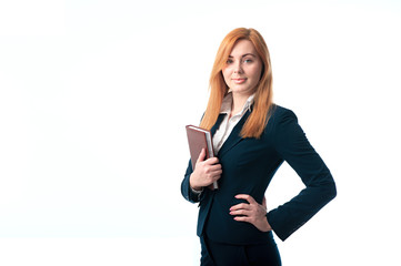 Red-haired businesswoman with a diary in hands
