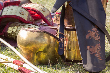 Ancient Roman armor of leather and metal lying on ground