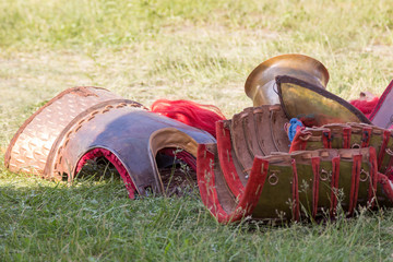 Ancient Roman armor of leather and metal lying on ground
