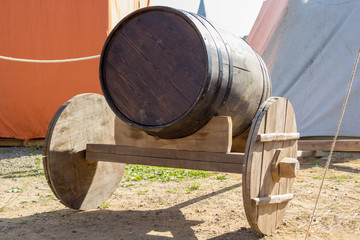 ancient wooden cart with wooden barrel