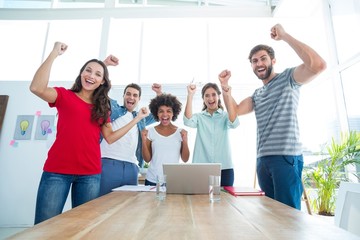 Fototapeta premium Happy business team with fists in the air