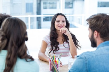 Cheerful creative business team in meeting 