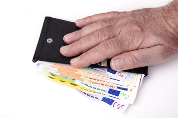 Hand reaching for wallet with banknotes