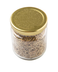 Dried rosemary herbs in a mason jar over white background