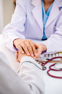 portrait of doctor consulting and cheering patient