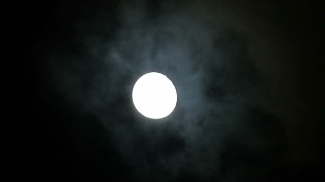 Full moon behind clouds. Audio track with cicadas.