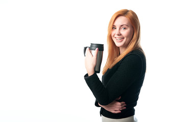 beautiful woman drinking coffee from a thermos