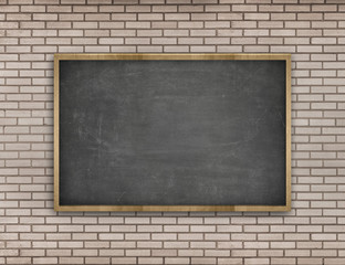 Black blank blackboard with wooden frame on brick wall