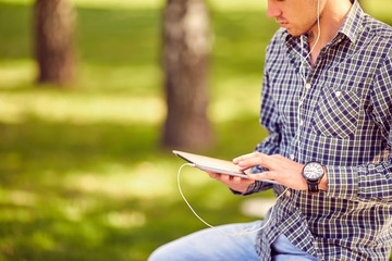 Education, technology and internet concept - smiling male studen