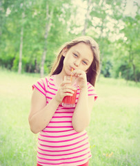 Girl drinks juice