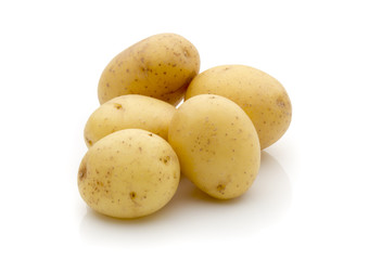 Potatoes on the white background.  New harvest.