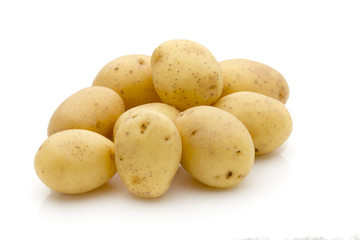 Potatoes on the white background.  New harvest.