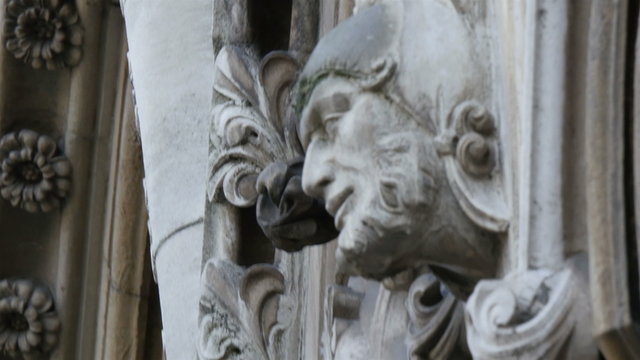 An image of the faces sculpted on the wall of Westminster Abbey Well made from the artist making the church more attractive to tourist
