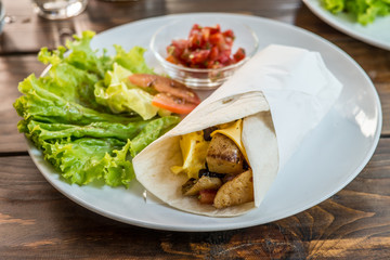 Breakfast Burrito with salad and salsa