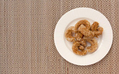 Thai style pork rind snack with space on background
