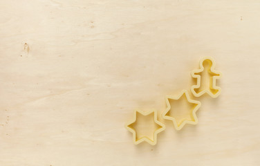 Yellow tone wood background with star cookie cutter