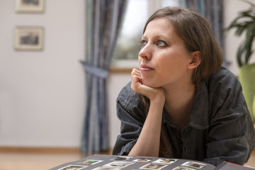 Woman with old photo album