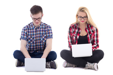 teenage girl and boy sitting with laptops isolated on white