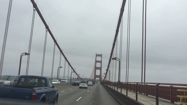Driving slowly across Golden Gate Bridge and filming through sunroof