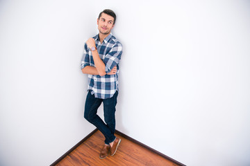 Businessman in casual cloth standing corner of the room