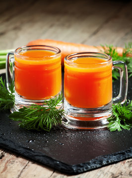 Fresh carrot diet  juice  in old-fashioned glass mug, selective