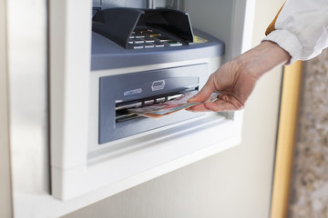 Woman at cash machine