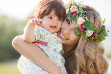 Happy woman with a child resting on the nature