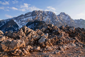 Fototapeta na wymiar Mountain snowy landscape with rock