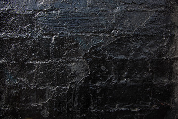 Brick wall painted black