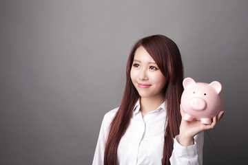 business woman with piggy bank