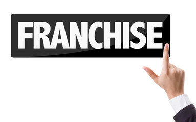 Businessman pressing button with the text: Franchise
