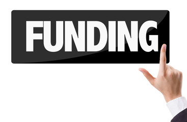 Businessman pressing button with the text: Funding