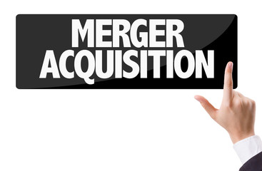 Businessman pressing button with the text: Merger Acquisition