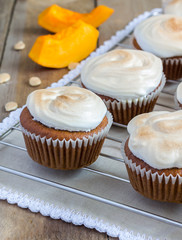 Homemade pumpkin cupcakes decorated with meringue