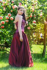 Beautiful woman is wearing fashion dress in park