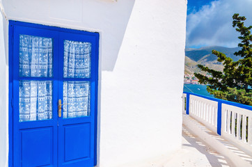Blue door in front of Greek house, Greece