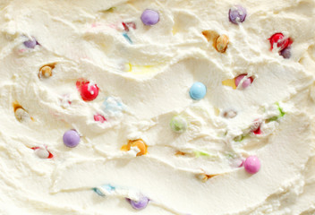 Creamy ice cream with colorful candy pearls